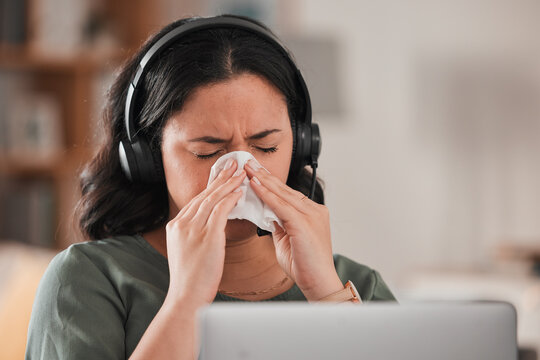 Woman, sick and blowing nose in work from home office for allergies, cold virus and flu risk of telemarketing consultant. Female virtual assistant, sales agent or sneeze at laptop for allergy problem