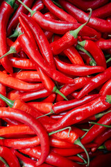 Pattern of red chilly peppers, overhead view