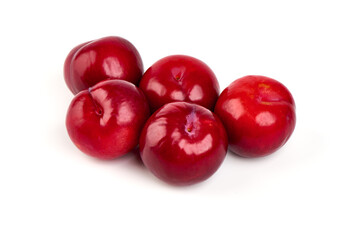Red plums, isolated on white background.