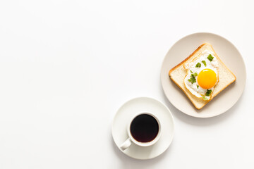 Breakfast with fried eggs on toast bread and cup of black coffee