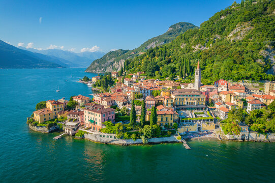 Varenna, Como Lake. Aerial panoramic view of town surrounded by mountains, blue sky and turquoise water and located in Como Lake, Lombardy, Italy
