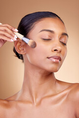 Beauty, makeup and product with woman and brush in studio for facial, foundation and self care....