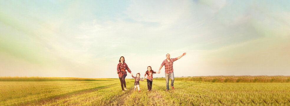 family running together in the field - Powered by Adobe