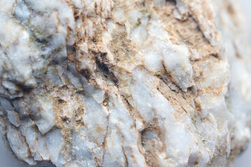 A piece of raw marble. Macro shooting of metamorphic rock specimens - marble stone