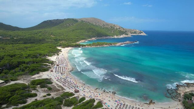 Aerial view of Cala Agulla beach in Mallorca, Spain, on a hot summer day