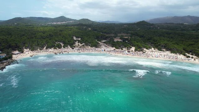 Aerial view of Cala Agulla beach in Mallorca, Spain, on a hot summer day