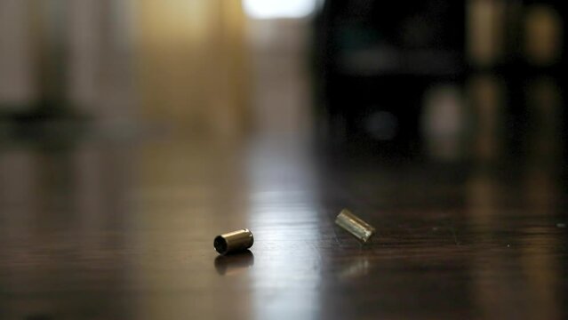 Spent 9mm brass bullet casings falling inside slow motion