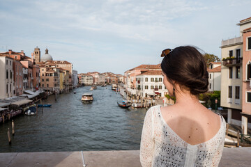 Fototapeta na wymiar Beautiful female model on the streets of Venice, Italy
