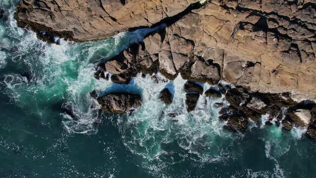 Waves Crashing against the Cliffs along the Oregon Coast. Angry Seas. Drone Aerial View. Video 001