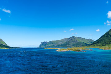 Summer sunny day at Lofoten, Norway, Nordland. Landscape with dramatic mountains and sea, ocean. fjord in the Lofoten Islands