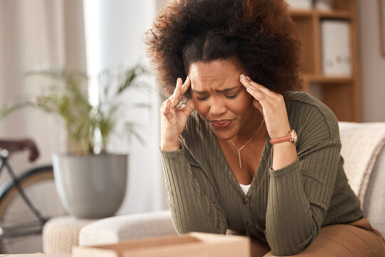Headache, woman and pain in home from stress, mental health problem and fatigue. Depression, sick and frustrated female with anxiety, burnout and tired from brain fog, vertigo and debt crisis