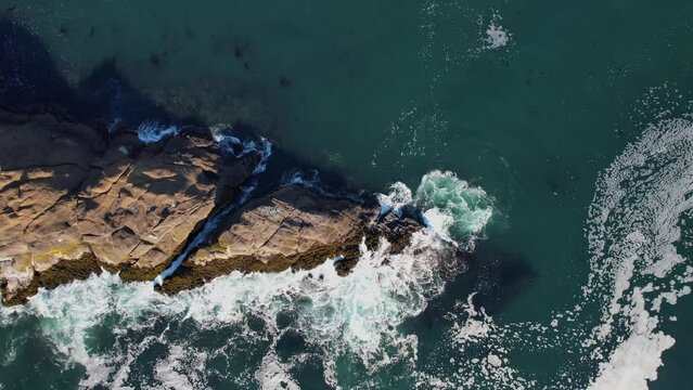 Waves Crashing against the Cliffs along the Oregon Coast. Angry Seas. Drone Aerial View. Video 011