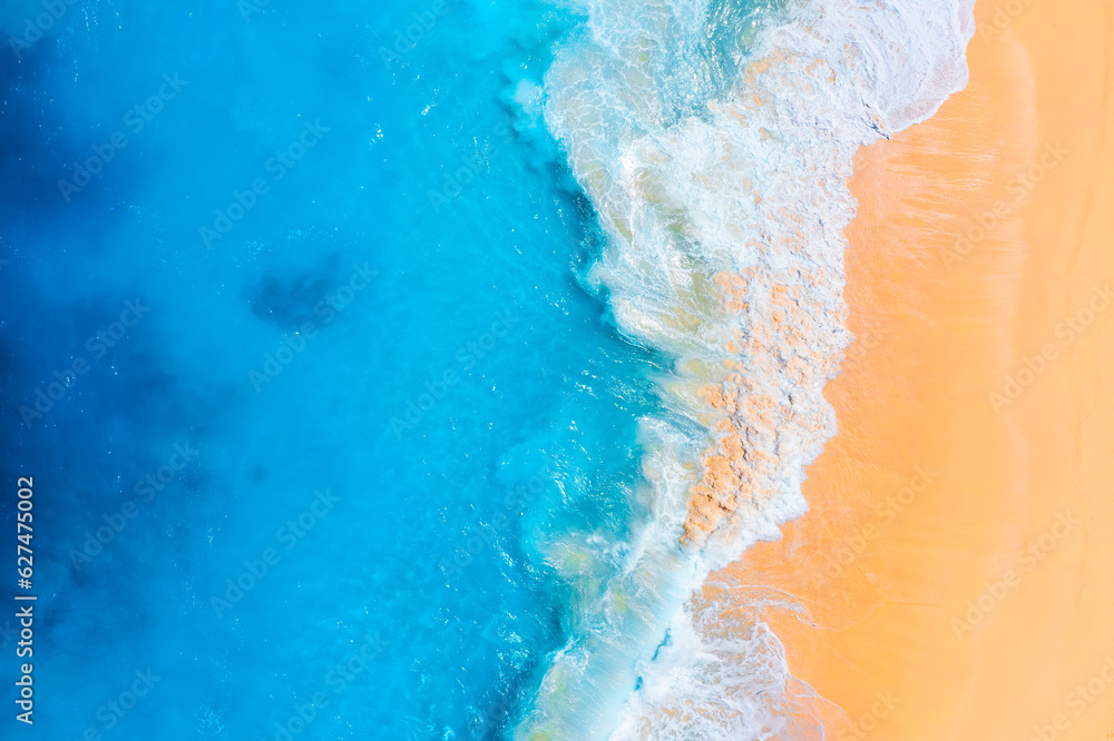 Wall mural coast as a background from top view. waves and beach. aerial landscape. azure water background from 