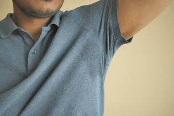 man with wet armpits Smelly odor from sweat .