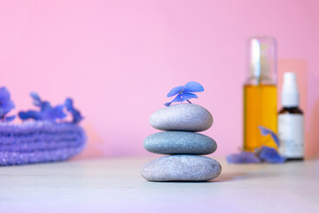 Obraz na płótnie Canvas Stack of pebbles, massage oil, towel. Relax calm concept.