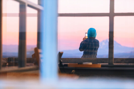 Person taking pictures of sunrise 