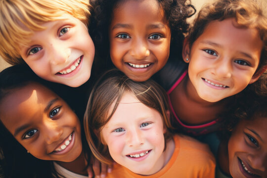 Group of cheerful happy multiethnic children outdoors