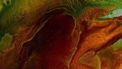 Abstract video of brown colors and greens, in the style of saturated pigment and organic formations. Fluid art with naturalistic landscape background. Liquid formation with swirling acrylics paints.