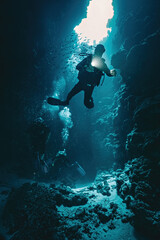 Man diver in Canyon dive site in Red Sea Egypt
