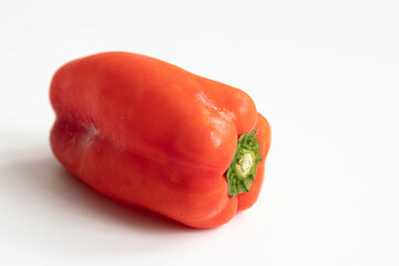 Slice of yellow bell pepper on a black background. Close up.