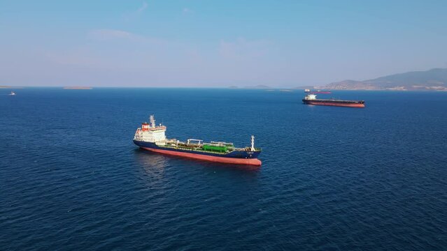 Oil chemical tanker carrier sea ship anchored in Aegean sea waiting entering port, Aerial view