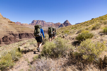 Fototapeta premium Hikers head along Grandview Trail in the Grand Canyon National Park