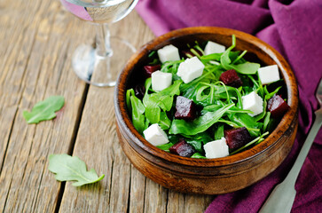 Arugula beet goat cheese salad in a bowl