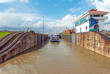Boat passing through the Miraflores locks of the Panama Canal, Panama.