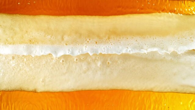 Super Slow Motion Shot of Splashing Beer Wave Background at 1000fps.