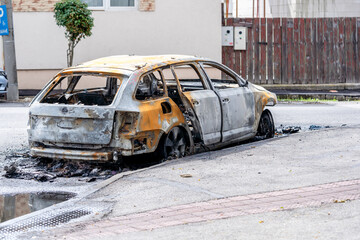 The car after the fire. Iron parts of a burnt car. Abandoned burnt-out car, due to a short circuit, arson.ready for scrapping