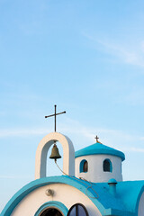 Top of Agios Dionysios church against a blue evening sky - Crete, Greece