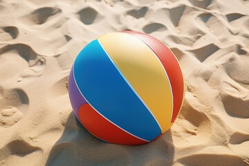 Colorful beach ball on sand top view
