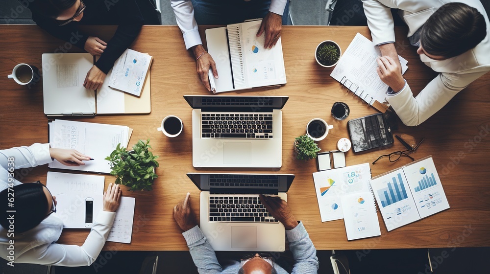 Poster business team hands at working with plan on office desk and modern digital computer laptop. top view