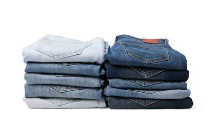 Stacks of different folded jeans isolated on white