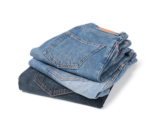 Stack of different folded jeans isolated on white