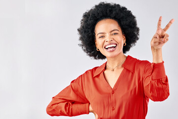 Crazy, peace sign and portrait of a black woman on a studio background with an emoji. Smile, funny...