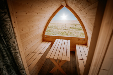 An igloo sauna made of wood, interior design, soft focus
