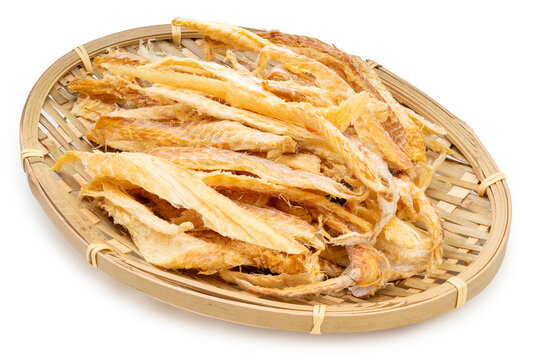 Korean Dried Pollock on wooden plate isolated on white background, Dried Pollock fish on white background With clipping path.