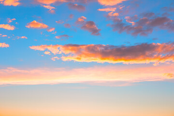 Clouds in the blue sky at sunset time. Nature heaven background