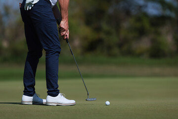 professional golf player hitting the ball