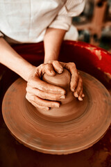 Creating things with my hands is what I love most. Cropped shot of an unrecognizable woman molding clay on a pottery wheel.