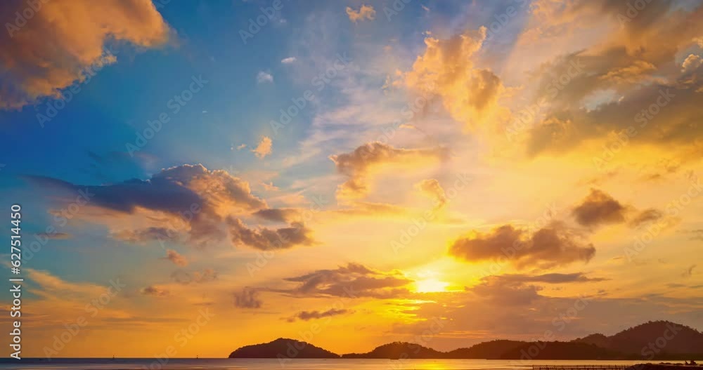 Wall mural colorful clouds over sea background,beautiful 4k time lapse of majestic sunset clouds sky landscape,