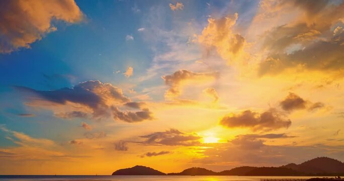 Colorful clouds over sea background,Beautiful 4K Time lapse of Majestic sunset clouds sky landscape,Amazing light of nature cloudscape sunset or sunrise sky