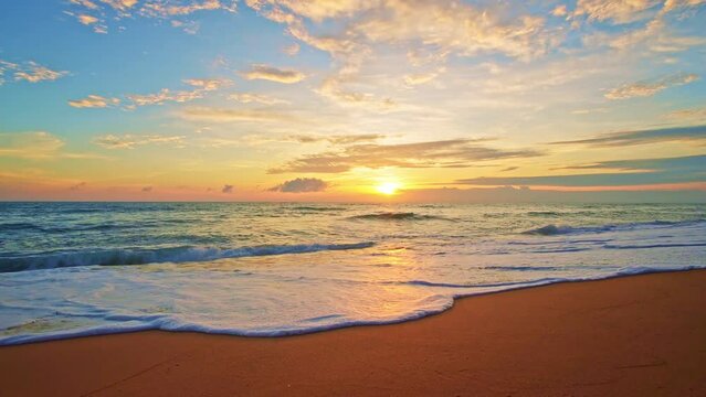 Dramatic sea sunrise or sunset sky over sea. Burning sky and shining golden waves landscape,Beautiful waves crashing on sandy shore