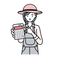 立って電卓を指差してこちらに向けて見せている農家の女性