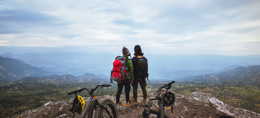  Asian lover woman and man Travel Nature. Travel relax ride a bike Wilderness in the wild. Standing...