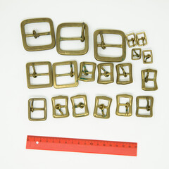 A collection of metal fittings used for leather products