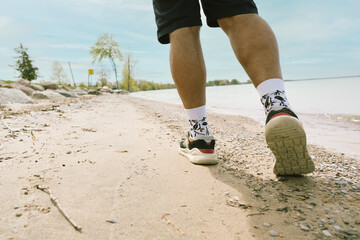 unrecognizable man walked on the beach, c