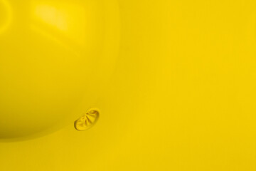a balloon placed in the upper left corner and a background with the same yellow tone, with space for text and cut horizontally