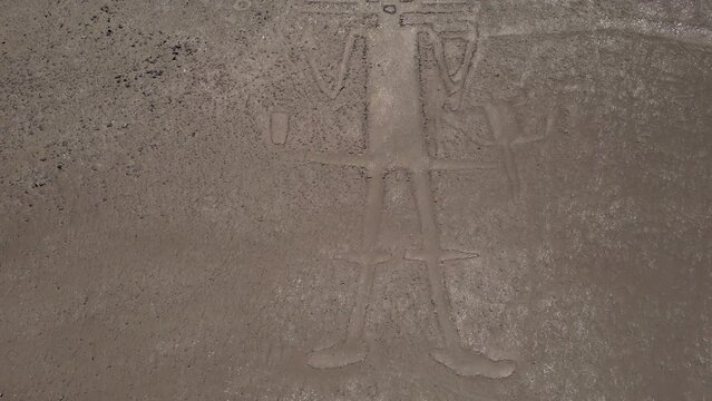 Tarapaca Giant its a large petroglyph on a rocky outcrop in the Atacama Desert, Tarapaca Region, northern Chile. It was created by native indigenous people of Chile in the year 900.
